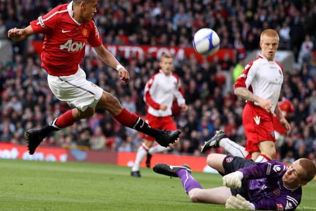 Sheffield United goalkeeper George Long makes a save from Manchester United's Ravel Morisson during the FA Youth Cup Final in 2011