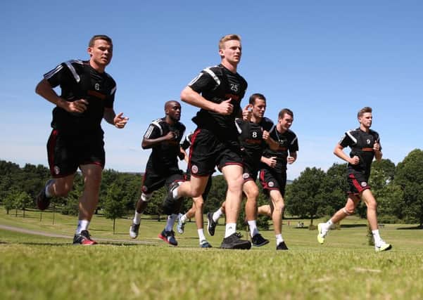 Sheffield United  training session in Graves Park, 10.7.14. 
L-R Andy Butler Jamal Campbell Ryce, George Long, Michael Doyle, Neill Collins & Chris Porter