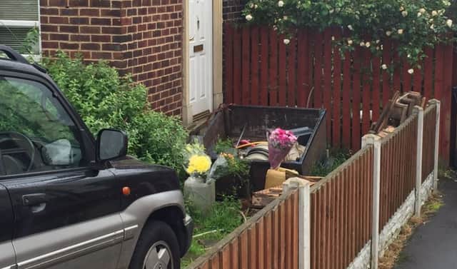 Flowers have been left in tribute to a woman who was found dead in her Shiregreen home. A murder investigation is underway