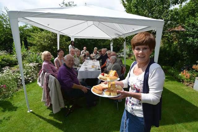 Eileen Harrington, of DonMentia, is pictured together with those who attended the tea party.