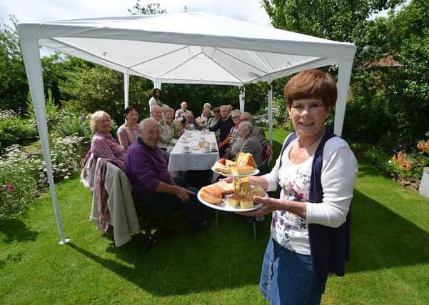 Eileen Harrington, of DonMentia, is pictured together with those who attended the tea party.