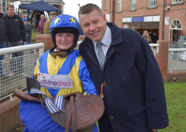RIDING HIGH -- jockey Lauren Steade with trainer Micky Hammond after her first ride in a competitive race.
