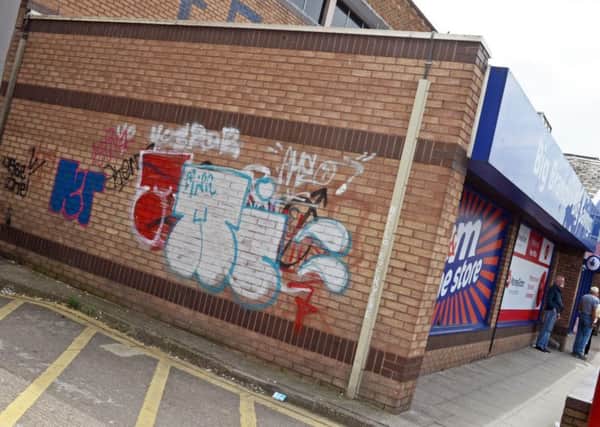 Many shops and buildings have been covered in graffiti on Middlewood Road, Hillsborough.  Picture: Marie Caley