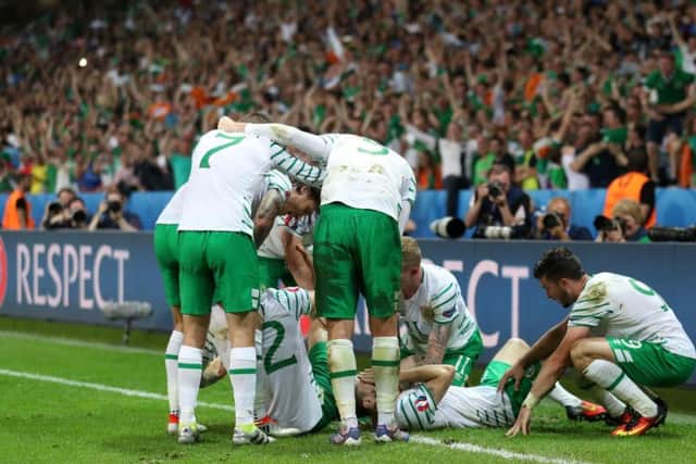 Republic of Ireland players celebrate Robbie Brady's winner against Italy on Wednesday night. PA Sport