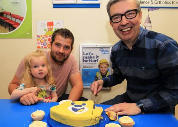 Bake it Better Day at Sheffield Children's Hospital with Howard Middleton a former contestant from the Great British Bake Off. Howard is pictured with Ricki Leather and Emileigh Iris Leather, two. Photo: Chris Etchels