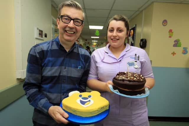 Bake it Better Day at Sheffield Children's Hospital with Howard Middleton a former contestant from the Great British Bake Off. Howard is pictured with staff nurse Ellie Ruta and her winning cake. Photo: Chris Etchells