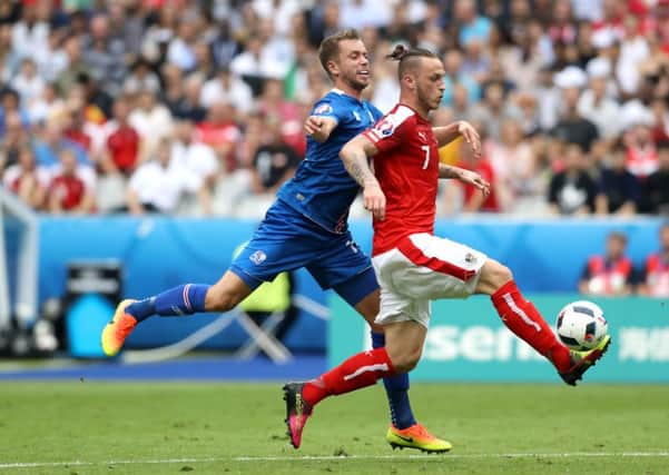 Kari Arnason in action for Iceland against Austria