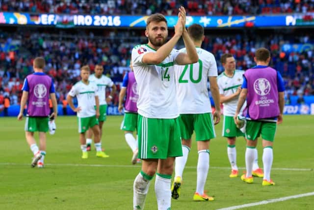 Stuart Dallas salutes the fans after Northern Ireland's defeat to Wales. PA SPORT