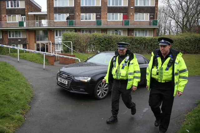 Police officers at a crime scene in Sheffield