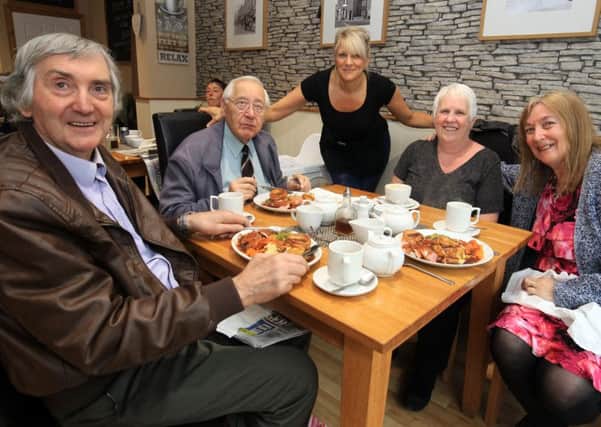 Natalie Lacey from Salon De Cafe in Crookes is delivering free meals to elderly people in Crookes who cannot get out of their homes. Natalie is pictured centre with Richard Copley-Baines, Dennis Bowling, Veronica Finch, and Pauline Copley-Baines.