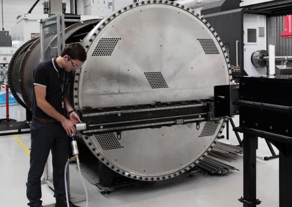 Jack Greaves, Nuclear AMRC research engineer, works on a heat exchanger assembly project for Rolls-Royce.