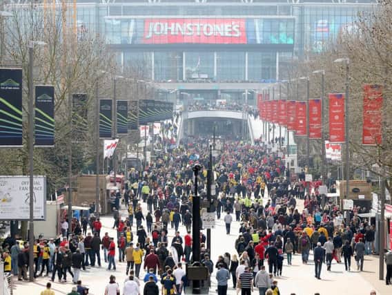 Barnsley and Oxford United fans on Wembley Way for last season's Football League Trophy final