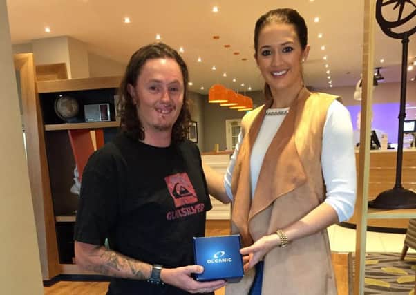 Rotherham-based Miss Universe GB finalist Jamie-Lee Faulkner presents injured war veteran Craig Wood, from Doncaster, with a dive computer to help him qualify as a PADI Open Water Diver.
