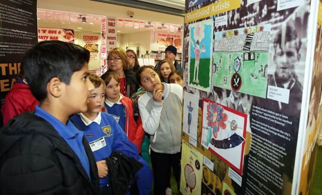 Some of the local schoolkids who entered the Youdan Trophy art competion see their work on display at the Moor Markets, Sheffield, United Kingdom on 1 July 2016. Photo by Glenn Ashley Photography