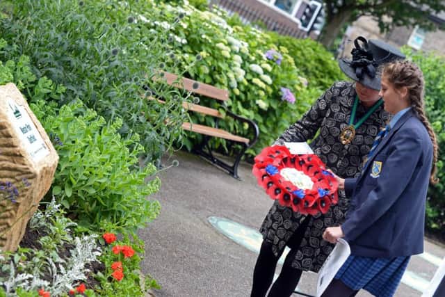 The Deputy Lord Mayor of Sheffield Anne Murphy and Molly Meleady-Hanley, 13, of Mount St.Mary's College, pictured laying a wreath during the Somme Anniversary service. Picture: Marie Caley NSST Somme Memorial MC 9