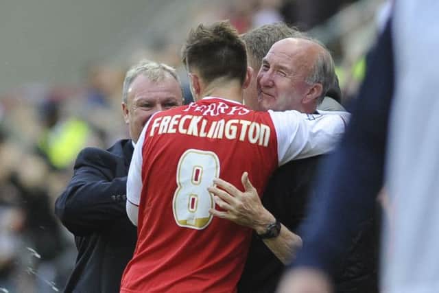 Embracing Denis Circuit after scoring against Preston in the play-off semi-final