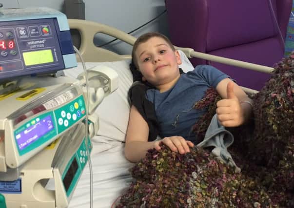 Alex Goodwin, aged nine, who is battling a rare form of bone cancer
