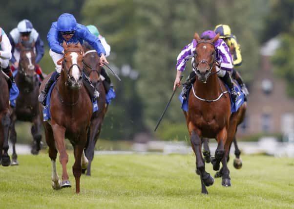 ECLIPSE OF THE SON -- Hawkbill (left), owned by Godolphin and ridden by William Buick, fends off odds-on favourite, The Gurkha, a son of super-sire Galileo, in Saturday's Coral-Eclipse Stakes at Sandown Park. (PHOTO BY: Racingfotos.com)
