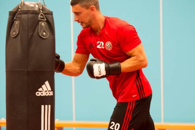 New signing James Wilson taking part in a boxing session as part of United's pre-season training at the EIS