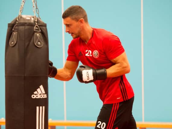 New signing James Wilson taking part in a boxing session as part of United's pre-season training at the EIS