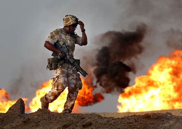 British troops from the 2nd Battalion Light Infantry during an evening patrol targeting oil smugglers at a gas and oil separation plant in Rauallah, Southern Iraq in 2003.