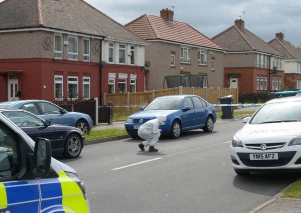 Police at the scene of a shooting in Hastilar Road South, Woodthorpe.