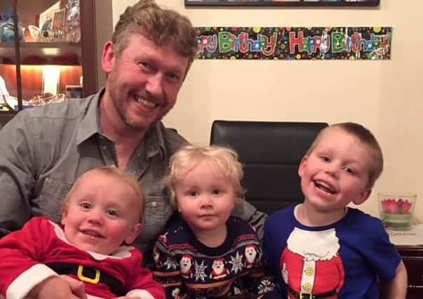 Tony Hadfield with his grandsons Toby, 21 months, Noah, three, and Joshua, four