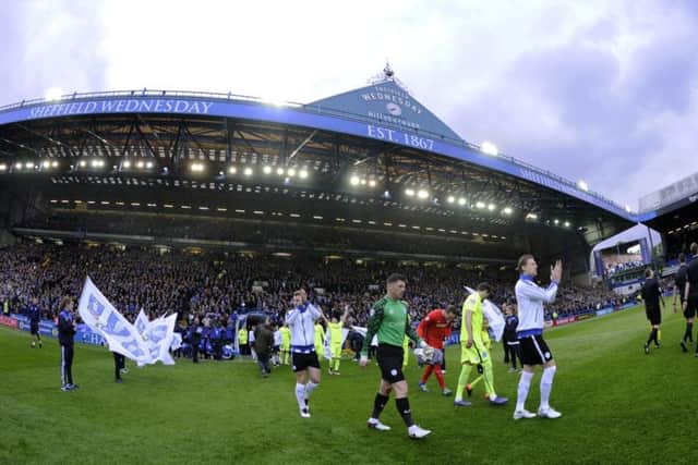 Owls skipper Glenn Loovens leads his team out at Hillsborough for the home leg of the Championship Play off