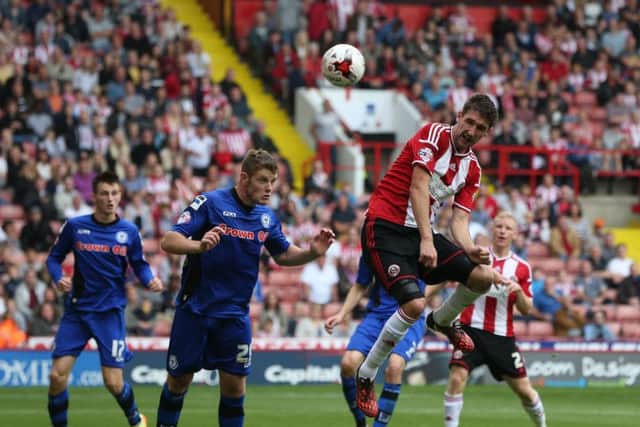 Jack O'Connell (left) in action for Rochdale against Sheffield United in the 2014/15 season