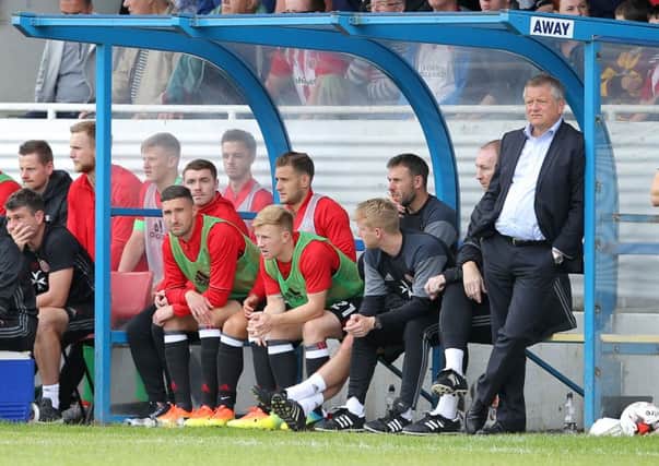 Chris Wilder (r) manager of Sheffield Utd and new signing John Fleck (l) during the pre season friendly at the Local Look Stadium, Stocksbridge