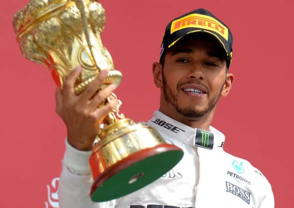 Mercedes' Lewis Hamilton celebrates after winning  the 2016 British Grand Prix at Silverstone. Photo: Tony Marshall/PA Wire.