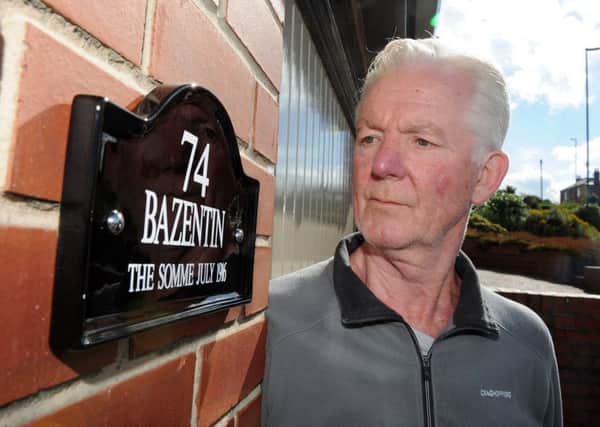 Joe Dunn, looks at the new house name sign on his house, at Wheel Lane, after a visit from his brother-in-law Harry Clough, who used to live in the house and who died in the battle of Bazentin. Picture: Andrew Roe