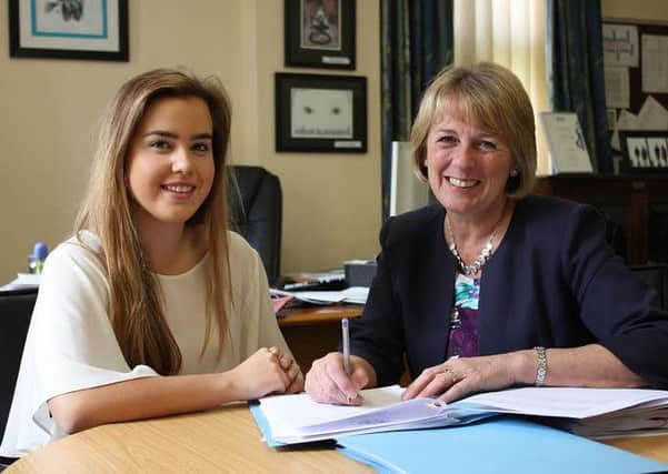 Alex Harrison joined forces with headmistress Valerie Dunsford.