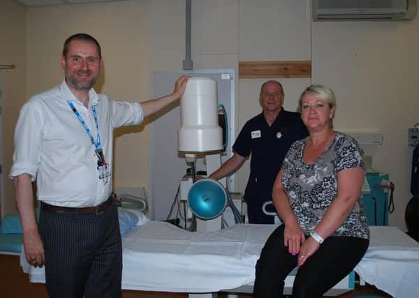 Stephen Mitchell,  consultant urological surgeon, Michelle Mahon and John Knowles, at Barnsley General Hospital.