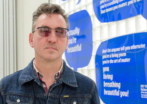 Richard Hawley unveils his poem, Hey You, at the Millennium Galleries in Sheffield as part of the Off the Shelf festival. Picture: Will Roberts