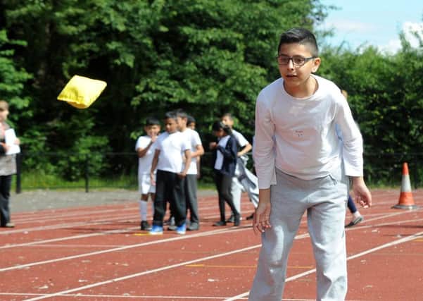 Raees Khan, of High Hazels Academy throws a bean bag at the Darnall Community Sports Day. Picture: Andrew Roe