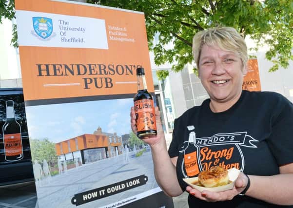Debbie Raynes, Hendersons business administrator sporting her Strong & Northern T-shirt with an artists design of what the pub will look like.  Picture: Marie Caley