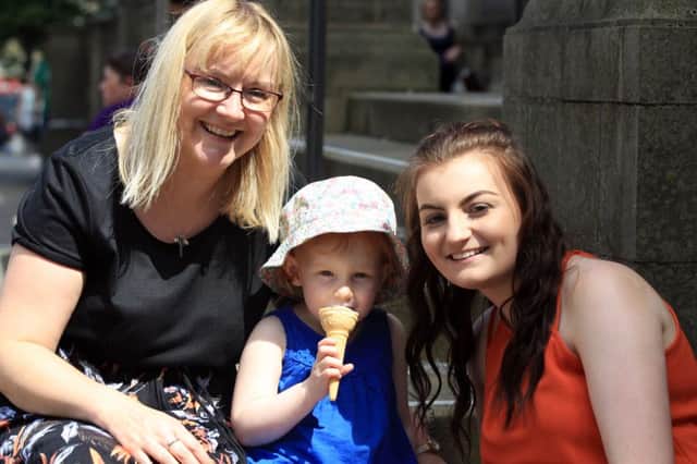 Fun in the sun in Sheffield. Enjoying an ice cream are Emma Redfern, Phoebe Redfern, three, and Katie Marsden.