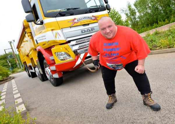 Strongman, Simon "Power" Plant, pulls a 13-tonne truck at Bluebell Children's Hospice