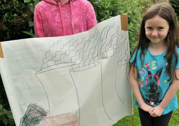 (Top left clockwise) Kirsten Broadhead, 11, Lucy Broadhead, six, and Emma Wrightson, six, of Silkstone Common, are at Old Moor Centre learning about habitats in the wetlands. Picture: Andrew Roe