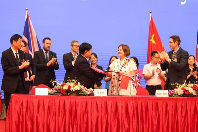 Sheffield Council leader Julie Dore signs a 60-year partnership deal with Wang Chunming, chairman and president of Chinese firm Sichuan Guodong Construction Group, in Sheffield's sister city Chengdu.