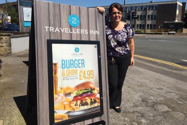 The McDonald's site is planned right across the road from the Travellers Inn pub on The Common. Pictured is manager Ann Martin
