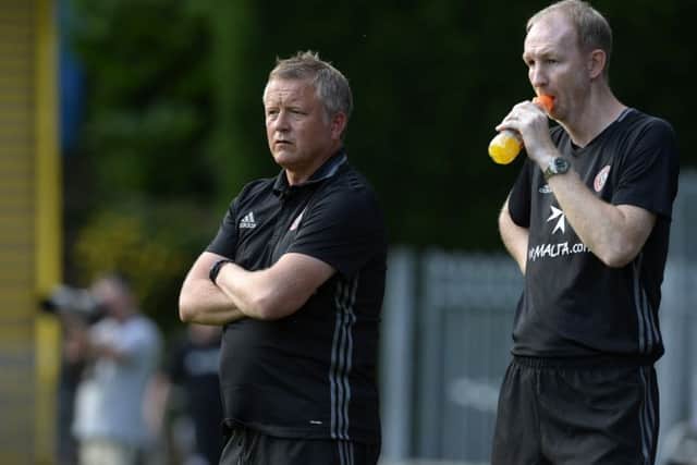 Chris Wilder (left) and his assistant Alan Knill watch Tuesday's friendly at The Shay