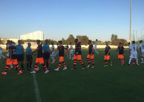 Owls players and their Nacional counterparts ahead of their match in Albufeira PIC: SWFC