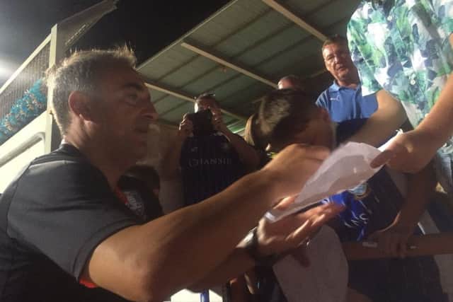 Carlos Carvalhal signs autographs for young fans PIC: SWFC