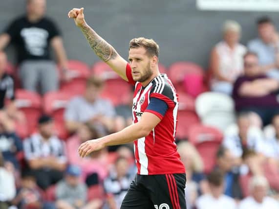 Billy Sharp celebrates one of his two goals against Grimsby Town