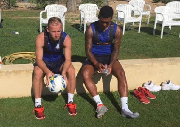 Barry Bannan and Liam Palmer take a well-earned rest from training
