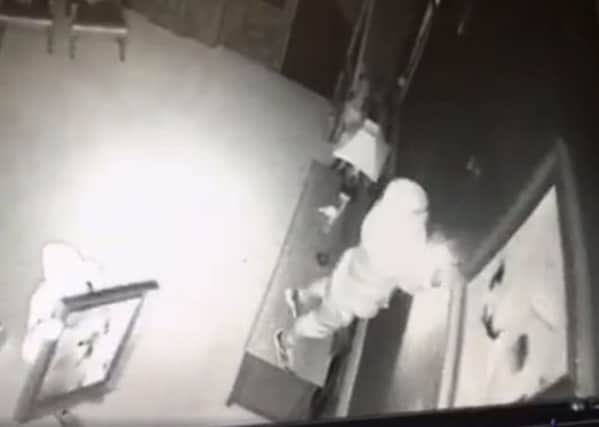 CCTV still of a break-in at Rossington Hall, Doncaster in which several paintings were stolen