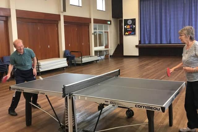 Pete Gannon and Val Hughes playing table tennis