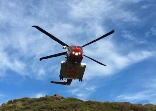 Edale Mountain Rescue Team, Buxton Mountain Rescue Team, Derbyshire Constabulary, East Midlands Ambulance Service and the Maritime and Coastguard Agency work together to rescue three 15-year-old casualties in the upper part of Grindsbrook Clough on Kinder Scout.